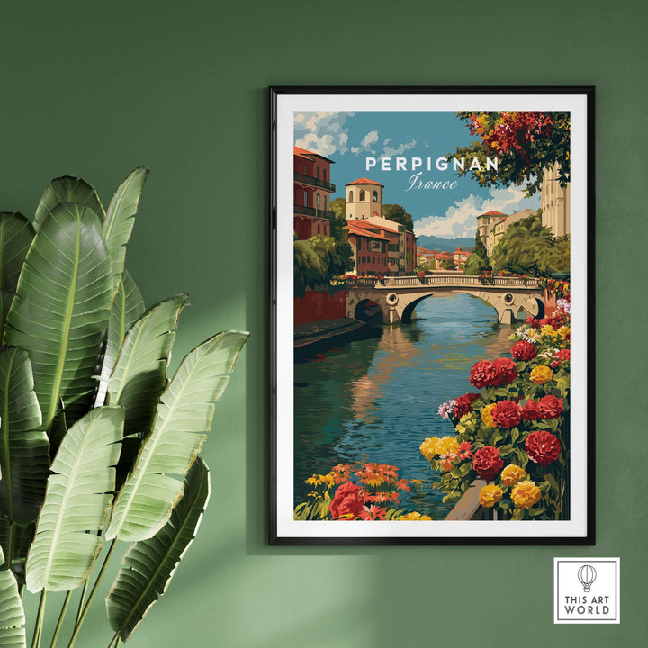Perpignan cityscape art print featuring River Le Basse and colorful flowers, framed on a green wall.
