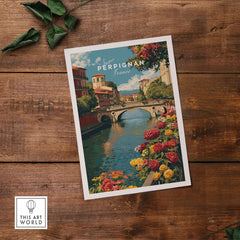 Perpignan Cityscape Art Print - French Village Poster - River Le Basse Wall Decor on a wooden surface.
