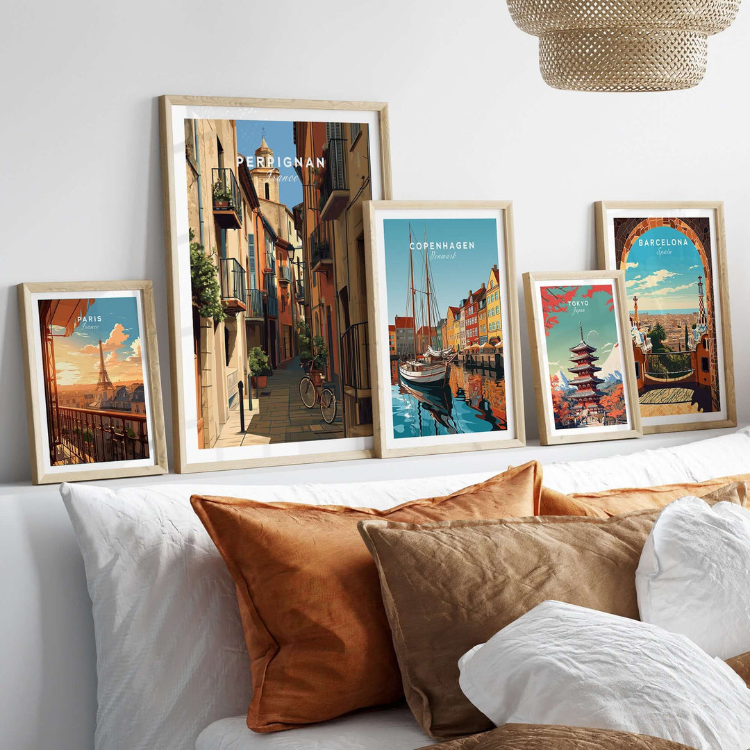 Perpignan poster and other travel art prints displayed on a cozy bed, enhancing home decor with European charm.