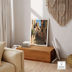 Perpignan Poster - French Village Art Print - Wall Decor displayed in a cozy living room setting.