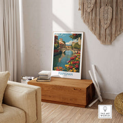 Perpignan River Poster - France Travel Print - Bridge and Flowers Wall Art displayed in a stylish living room setting.