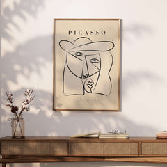 Picasso Abstract Face Hat Line Art Minimalist Portrait Poster Print Modern Gallery on a wall with decorative elements.