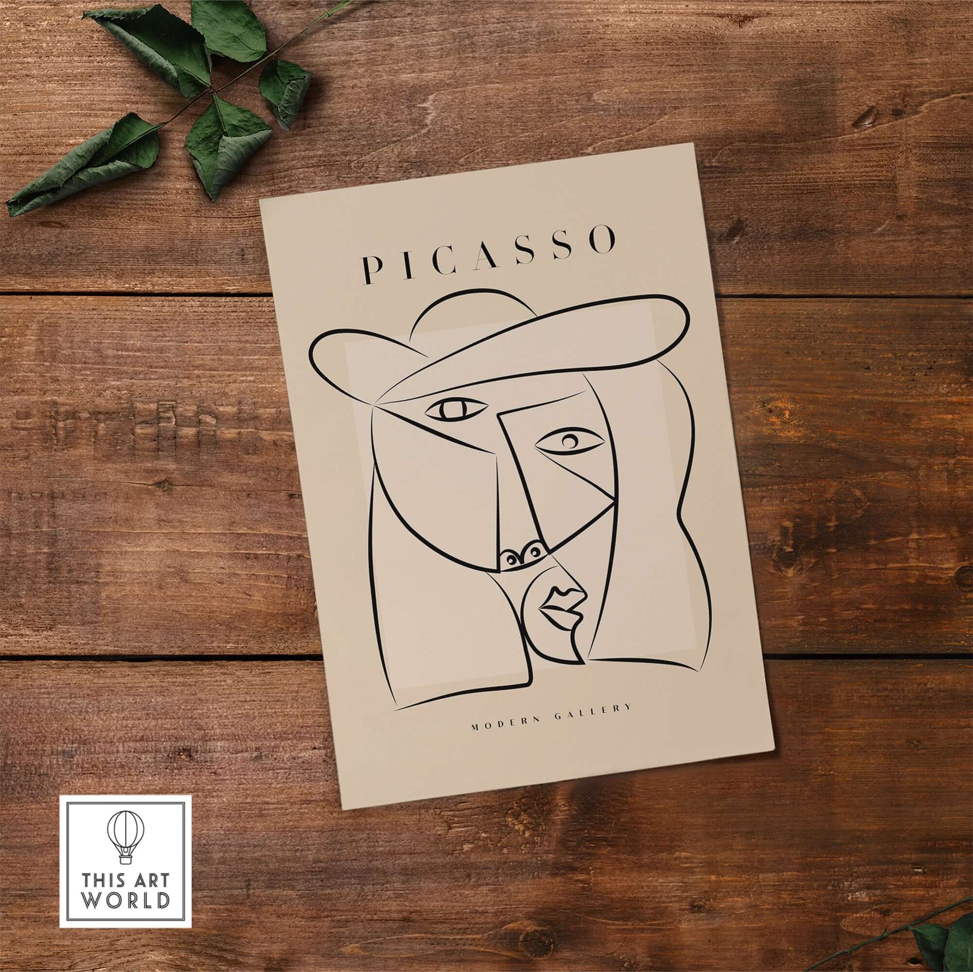 Picasso Abstract Face Hat Line Art Minimalist Portrait Poster Print Modern Gallery on a wooden surface.
