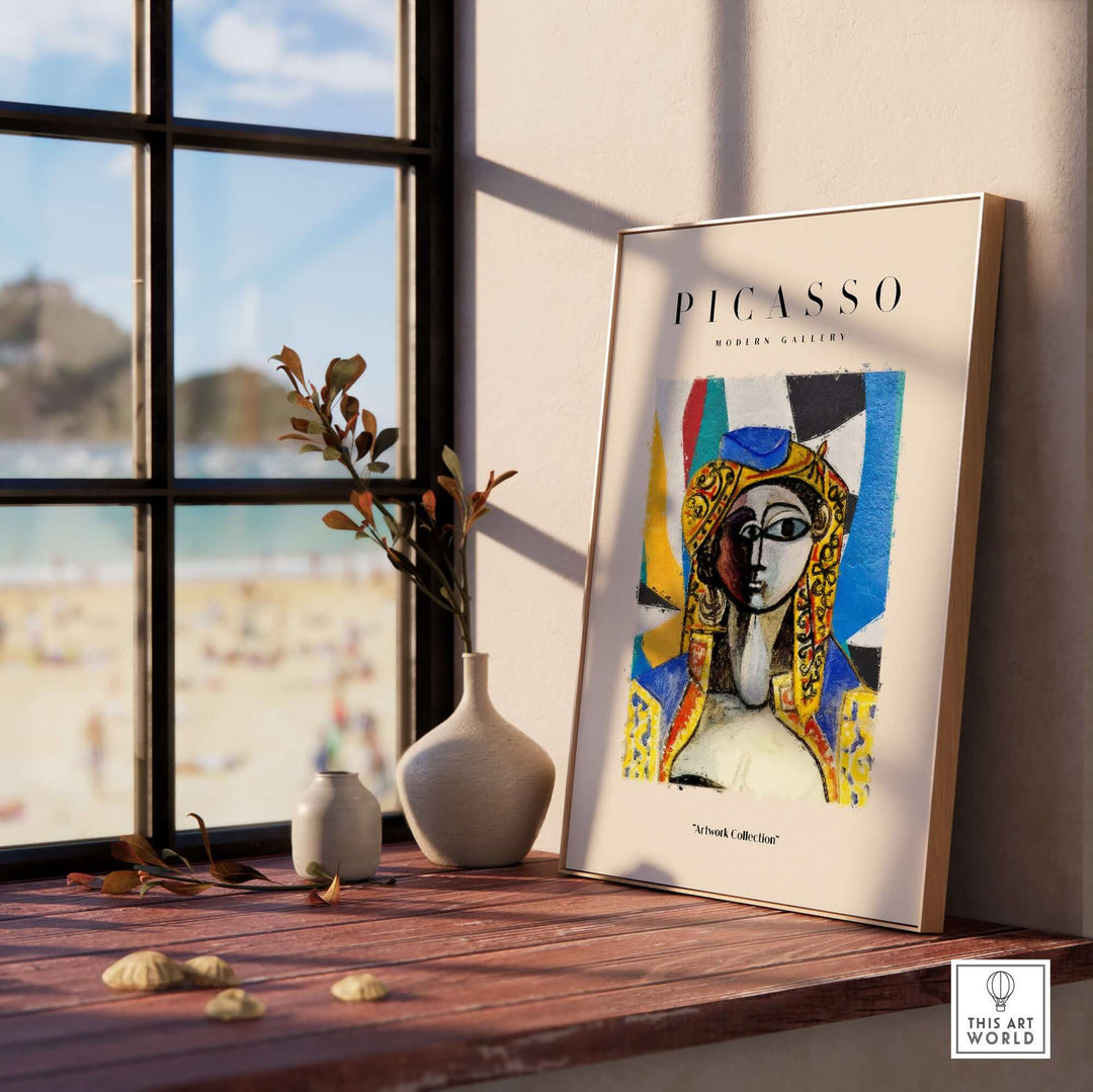 Colorful Picasso-inspired abstract face portrait poster displayed in modern gallery setting with beach view.