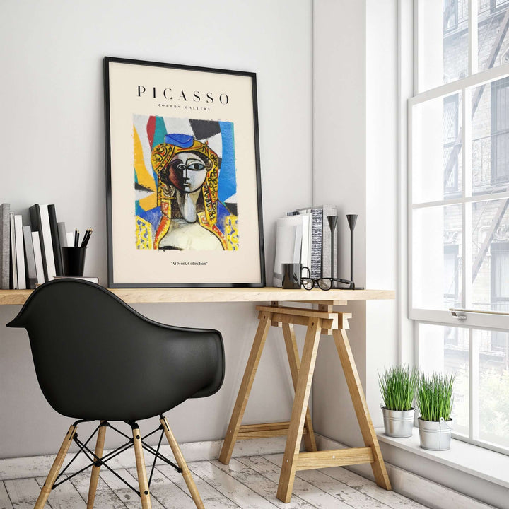 Colorful Picasso abstract face portrait poster on a modern desk in a stylish interior with natural light.