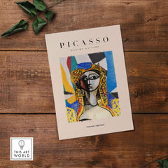 Picasso Abstract Face Portrait Poster Colorful Abstract Artwork Print Modern Gallery on a wooden table.