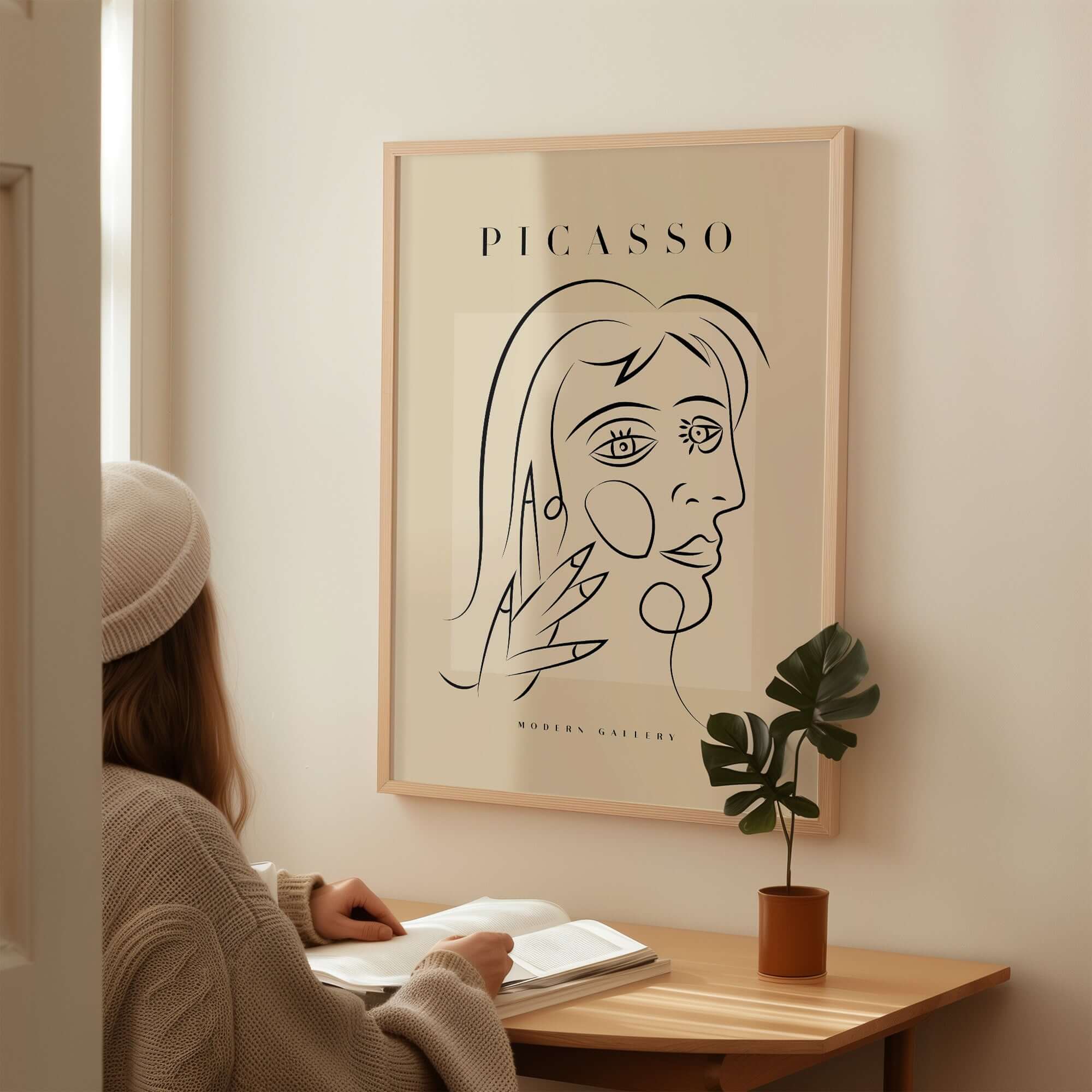 Picasso Face Profile Abstract Woman Line Art Modern Gallery Poster Wall Art displayed in a cozy modern interior.