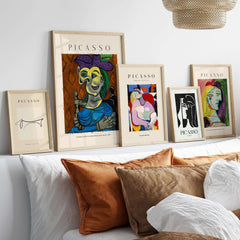 Picasso Seated Woman Blue Dress Dora Maar 1939 Art Print Cubist Portrait Poster and other framed art prints on a shelf.