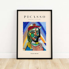 Picasso Bust Portrait Abstract Art Print Colorful Cubist Poster Artwork Collection in a modern frame on a wooden floor.