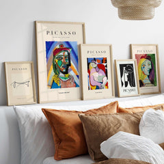 Picasso Bust Portrait Abstract Art Print Colorful Cubist Poster Artwork Collection displayed in stylish frames on a shelf.