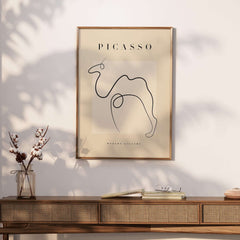 Picasso Camel Line Art Minimalist Animal Poster Modern Gallery Print Wall Art displayed on a stylish wall with a neutral background.