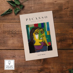 Picasso Contemplative Woman Abstract Art Print Colorful Portrait Poster Artwork Collection displayed on wooden surface.