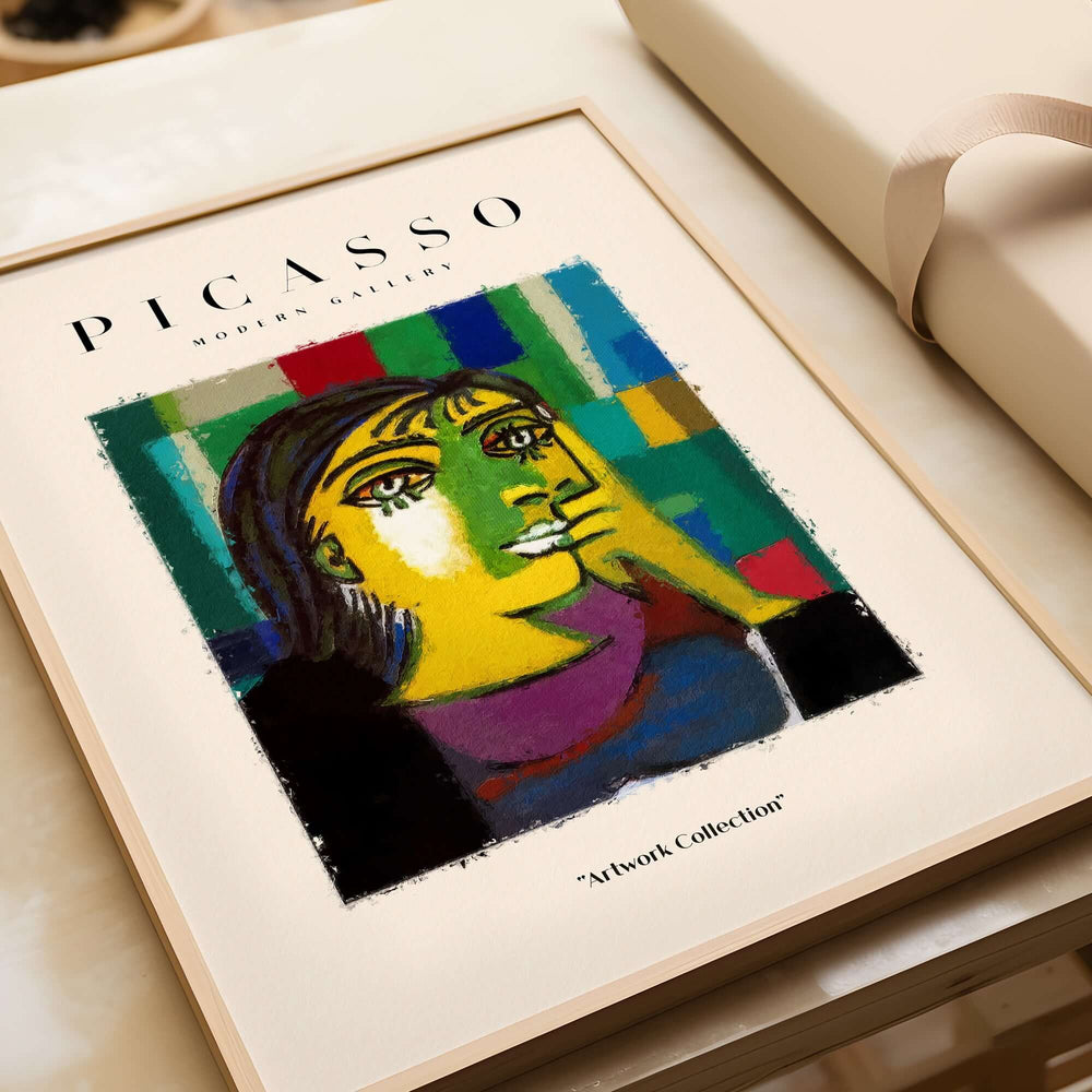 Picasso Contemplative Woman Abstract Art Print Colorful Portrait Poster Artwork Collection framed poster on a table.