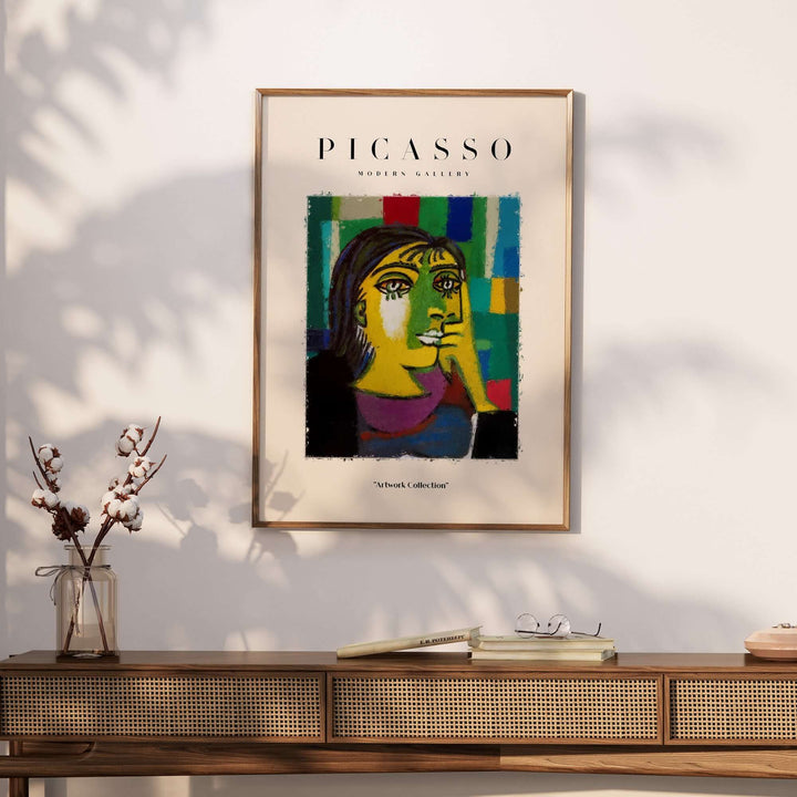 Colorful Picasso abstract portrait art print of a contemplative woman on a wall, stylish home decor.