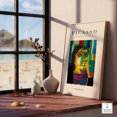 Picasso Contemplative Woman Abstract Art Print Colorful Portrait Poster Artwork Collection displayed in a bright room by the window.