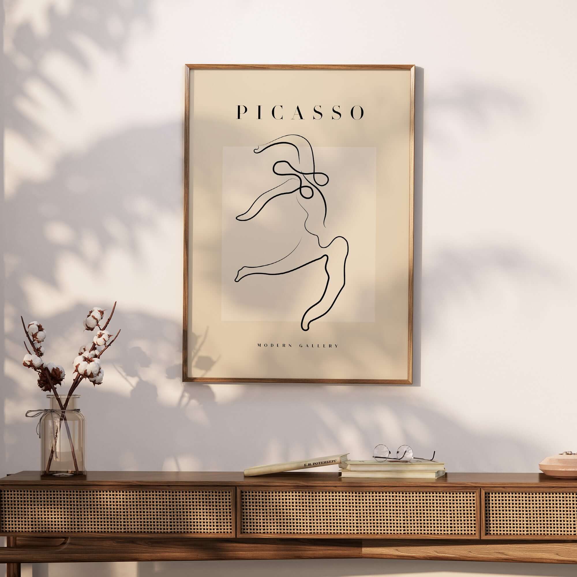 Picasso Dancing Figure Line Art Abstract Motion Poster Modern Gallery Print displayed on wall above a wooden console table.