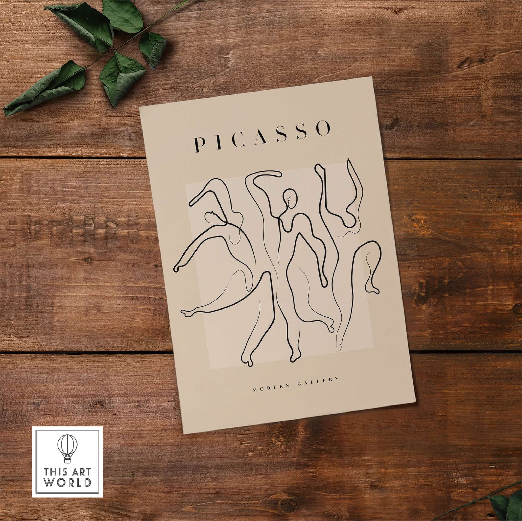 Picasso Dancing Figures Line Art Abstract Minimalist Poster Modern Gallery Print on wooden background with green leaves.