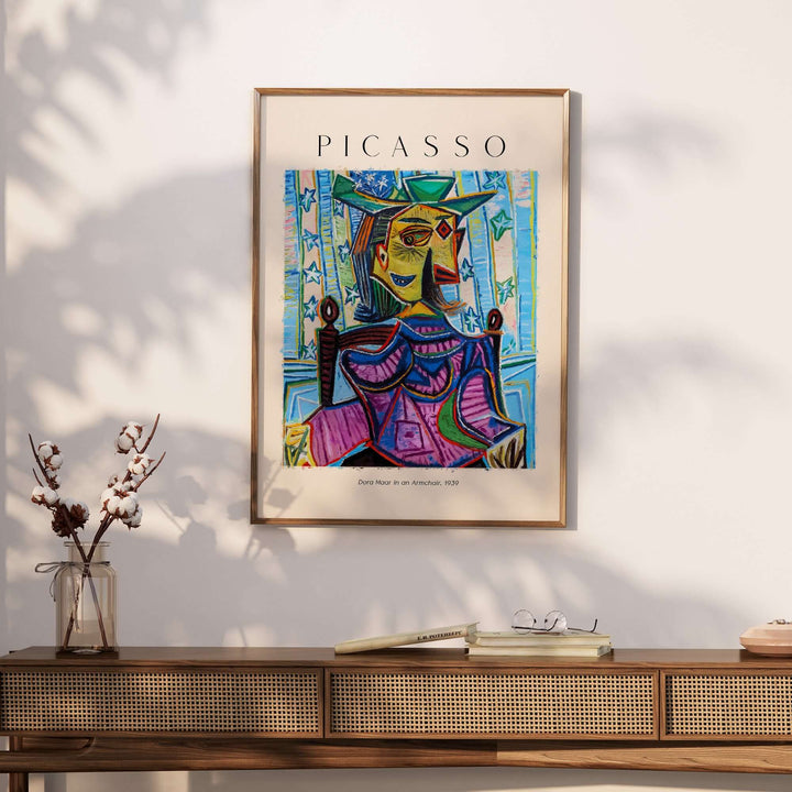 Cubist poster of Picasso's 'Dora Maar in an Armchair' featuring vibrant colors and abstract portrait style.