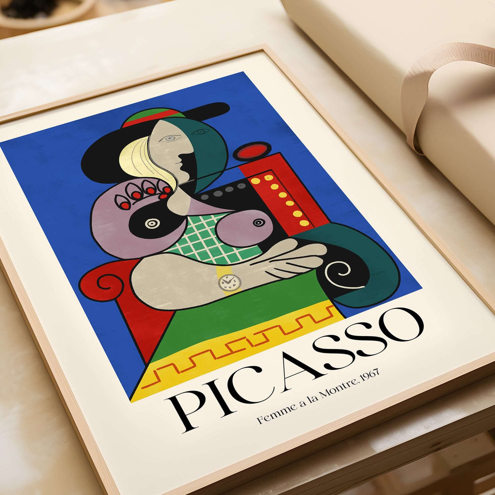 Picasso Femme a la Montre Woman Watch 1967 Art Print Cubist Poster Colorful Wall Art in a stylish frame on a table.
