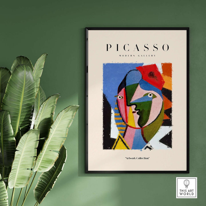 Colorful Picasso-inspired geometric face abstract art print poster framed on wall with plants.