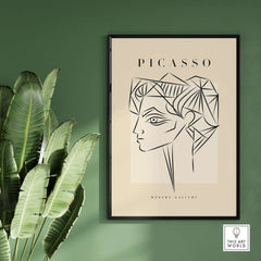 Picasso Geometric Profile Head Line Art Angular Abstract Poster Modern Gallery Print displayed on a wall with plants.