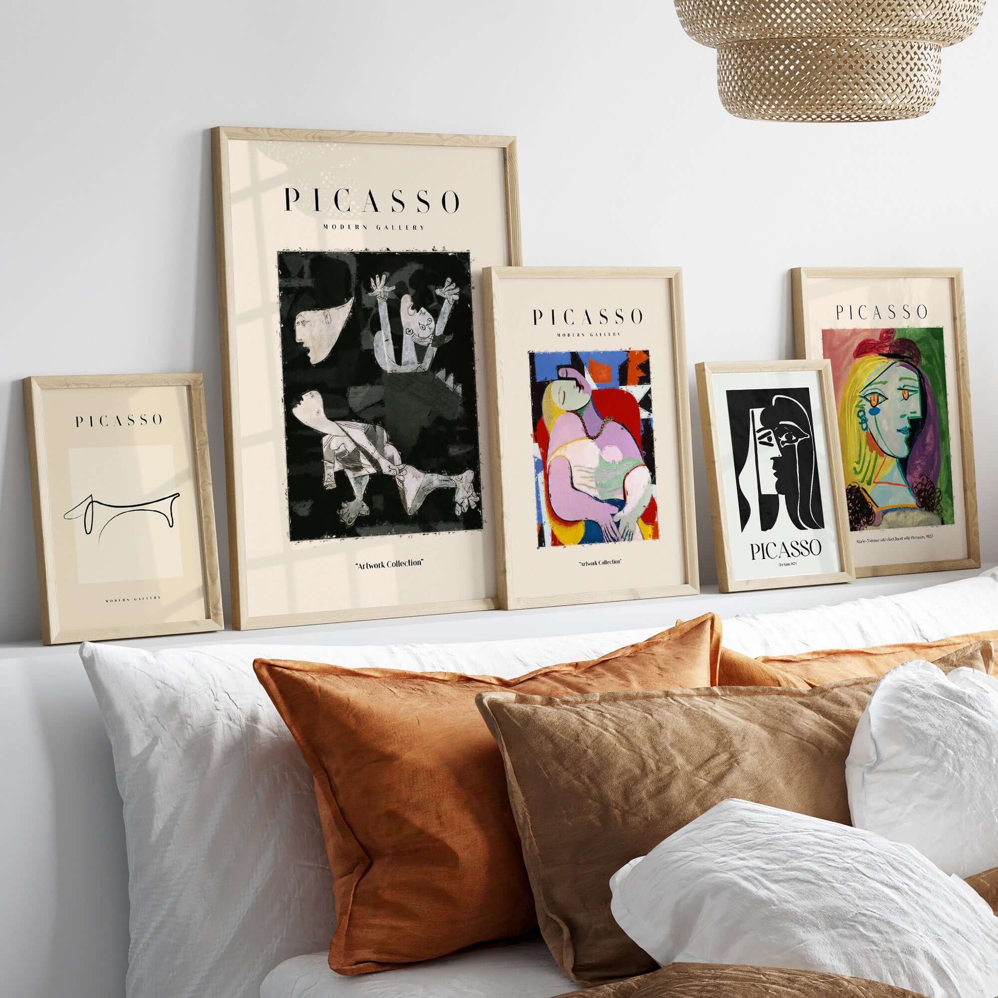 Picasso Guernica Inspired Falling Figures Art Print Abstract Black White Poster Collection displayed on a shelf.