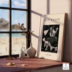 Picasso Guernica Inspired Falling Figures Art Print Abstract Black White Poster Collection displayed in a modern room with beach view.