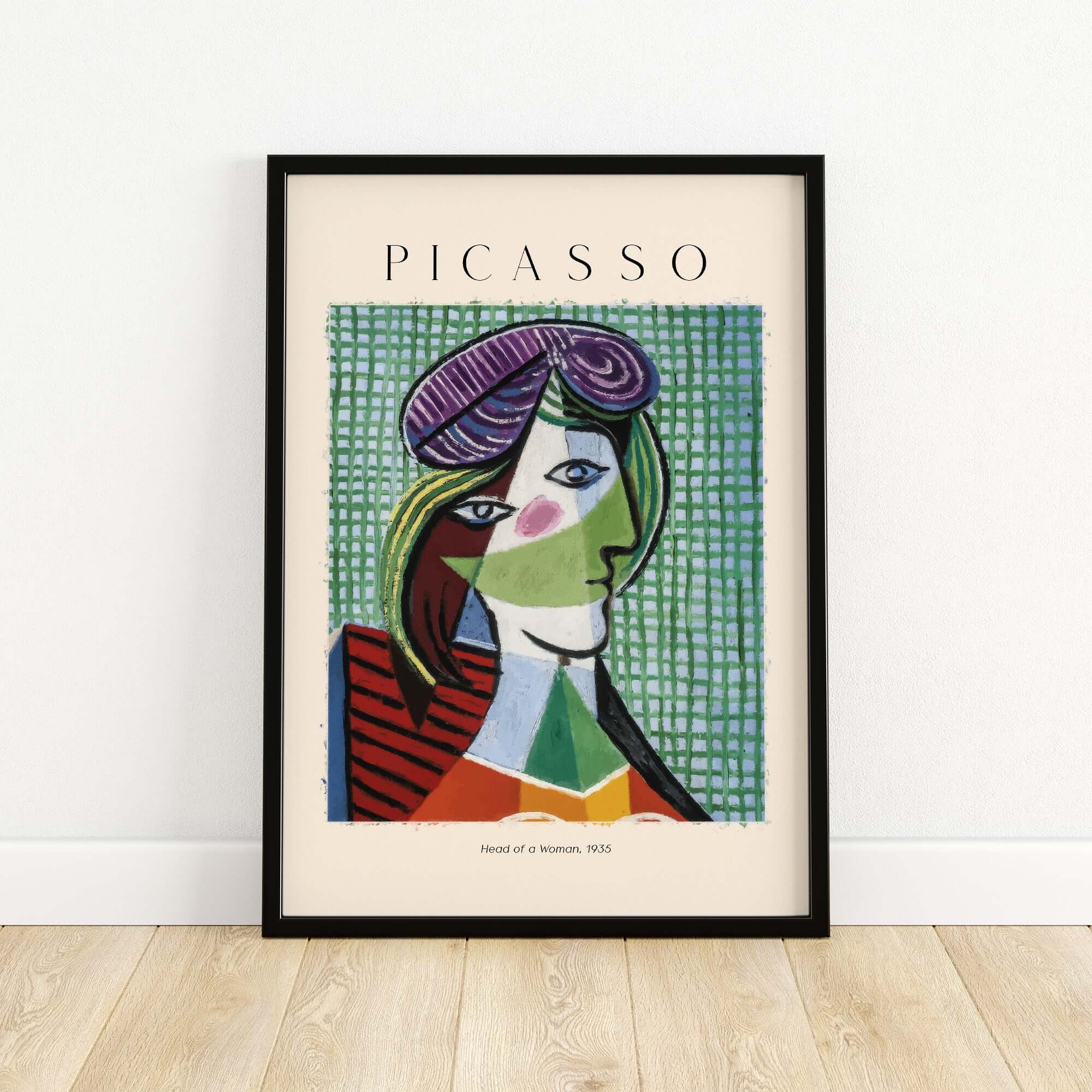 Picasso Head of a Woman 1935 Art Print Cubist Portrait Poster Colorful Wall Art framed on a wooden floor.