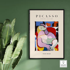 Picasso Le Rêve Inspired Reclining Woman Art Print Cubist Poster Artwork Collection framed on a wall with plants.