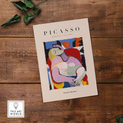 Picasso Le Rêve Inspired Reclining Woman Art Print Cubist Poster Artwork Collection displayed on wooden table.