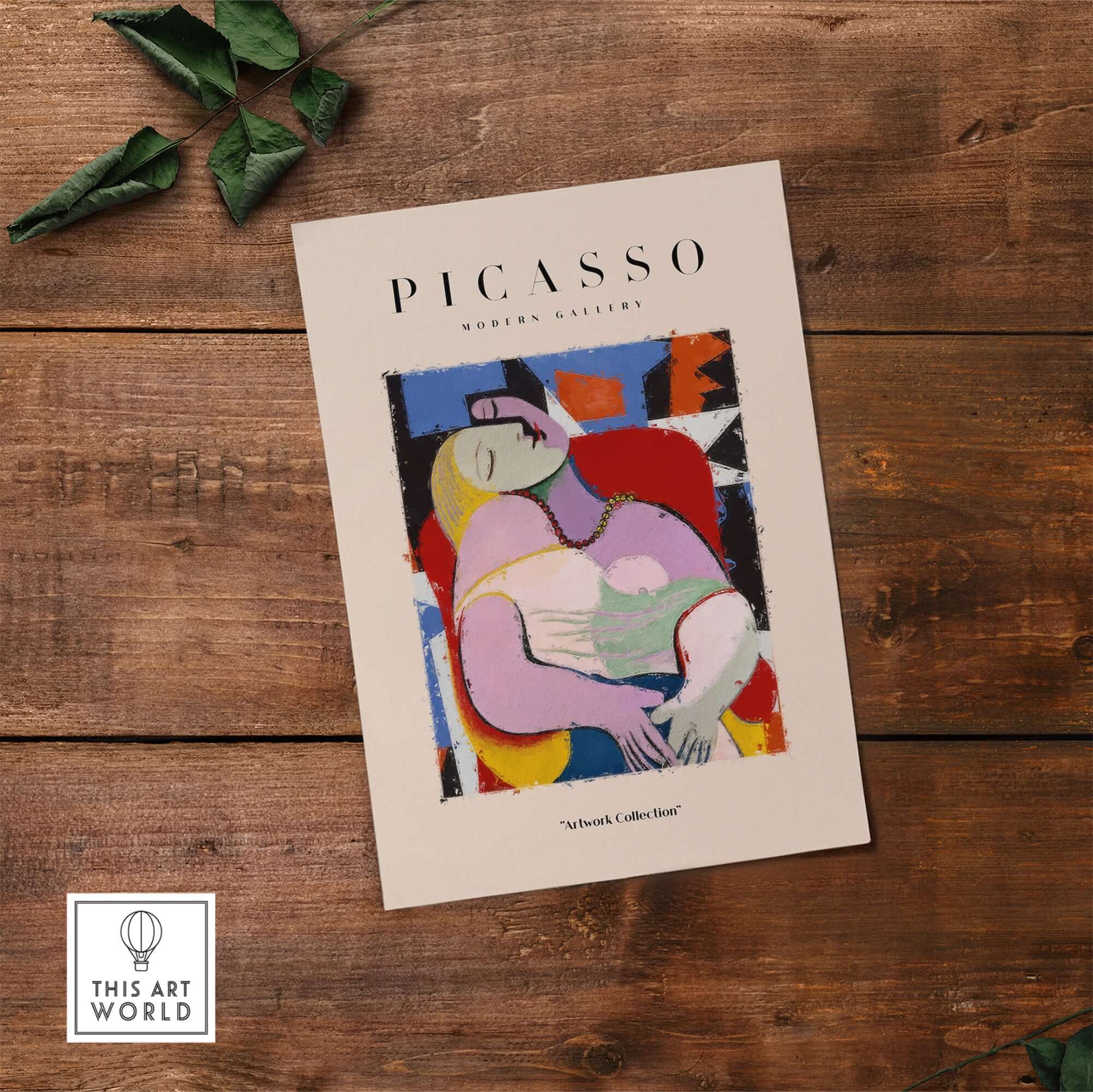 Picasso Le Rêve Inspired Reclining Woman Art Print Cubist Poster Artwork Collection displayed on wooden table.