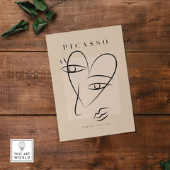 Picasso Line Art Abstract Heart Face Minimalist Modern Gallery Print Poster featuring expressive lines on a beige backdrop.