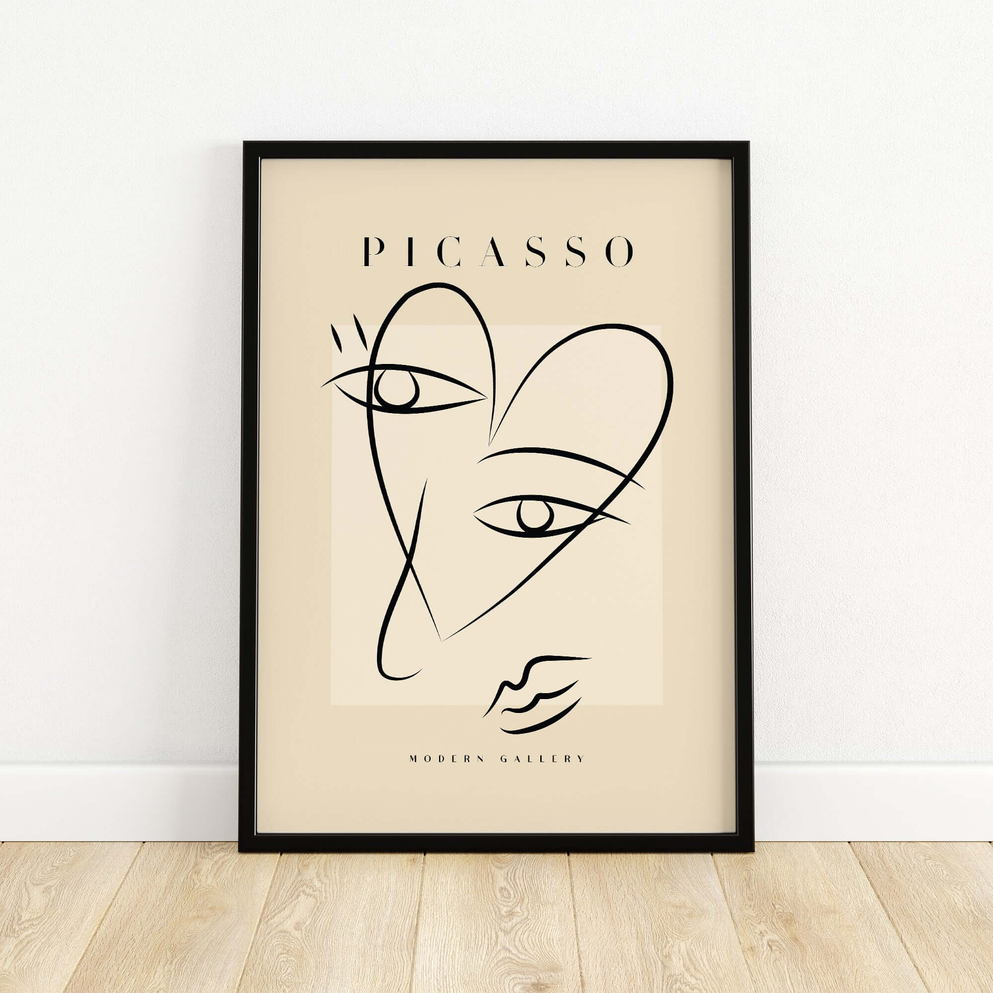 Picasso Line Art Abstract Heart Face Minimalist Modern Gallery Print Poster displayed in a black frame on a light wooden floor.