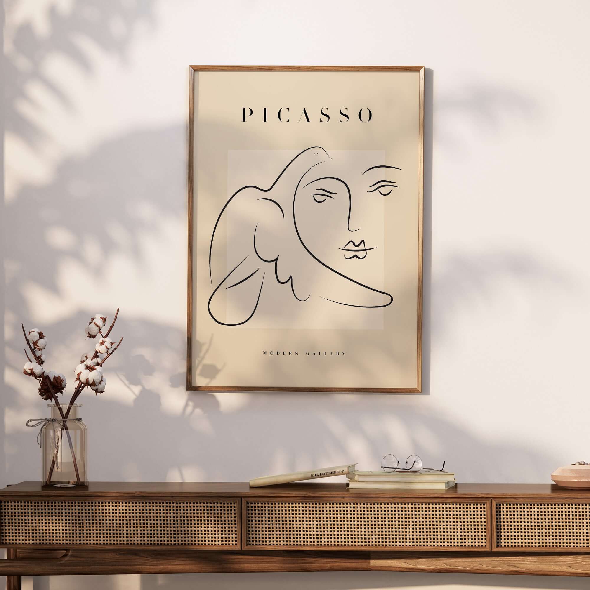 Picasso Line Art Face Dove Minimalist Modern Gallery Poster Print displayed on a wall with shadows and decor elements.