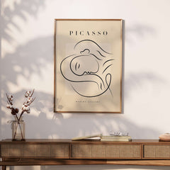 Picasso Line Art Reclining Sleeping Face Modern Gallery Poster Wall Art displayed on a wooden console table.