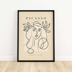Picasso Line Art Woman Leaf Crown Modern Gallery Wall Art Poster featuring minimalist female face on beige canvas.