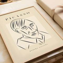 Picasso Man Portrait Sharp Lines Abstract Face Poster Modern Gallery Print Wall Art displayed in a stylish frame.