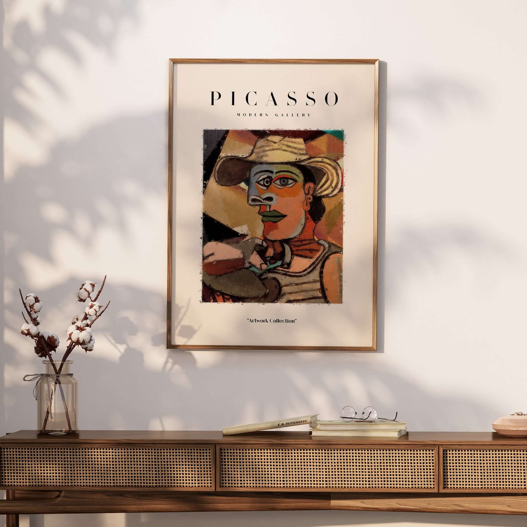 Picasso Man Straw Hat Abstract Portrait Art Print Cubist Poster Artwork Collection framed on a wall above a wooden table.