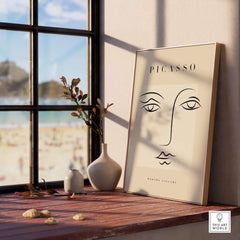 Picasso Minimalist Face Outline Line Art Simple Abstract Poster Modern Gallery Print displayed on a windowsill with beach view.