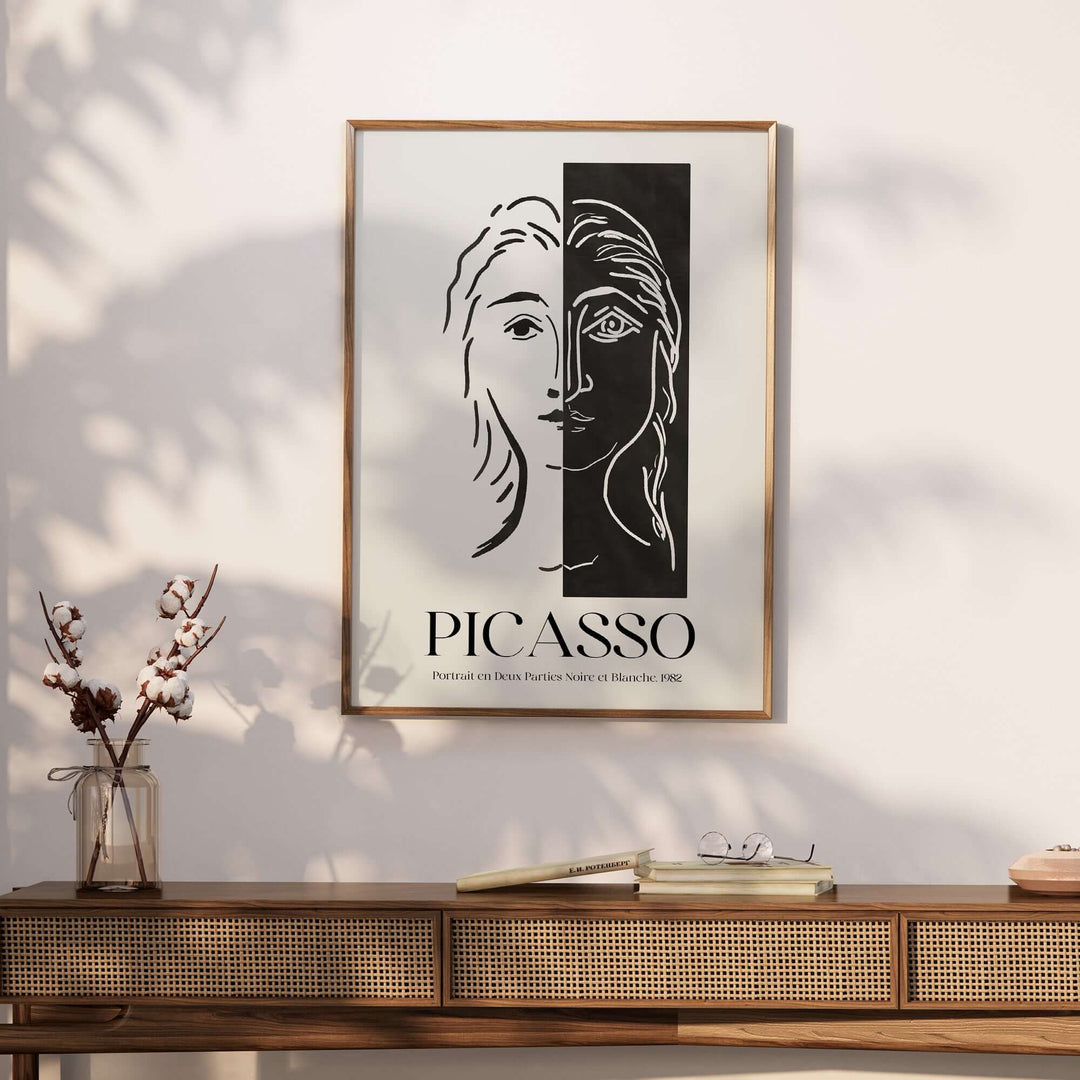 Picasso Portrait Deux Parties black and white split face art print poster on a wooden console table.