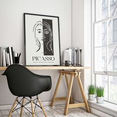 Picasso Portrait Deux Parties Black White Split Face Art Print Poster displayed in a modern workspace with minimal decor.