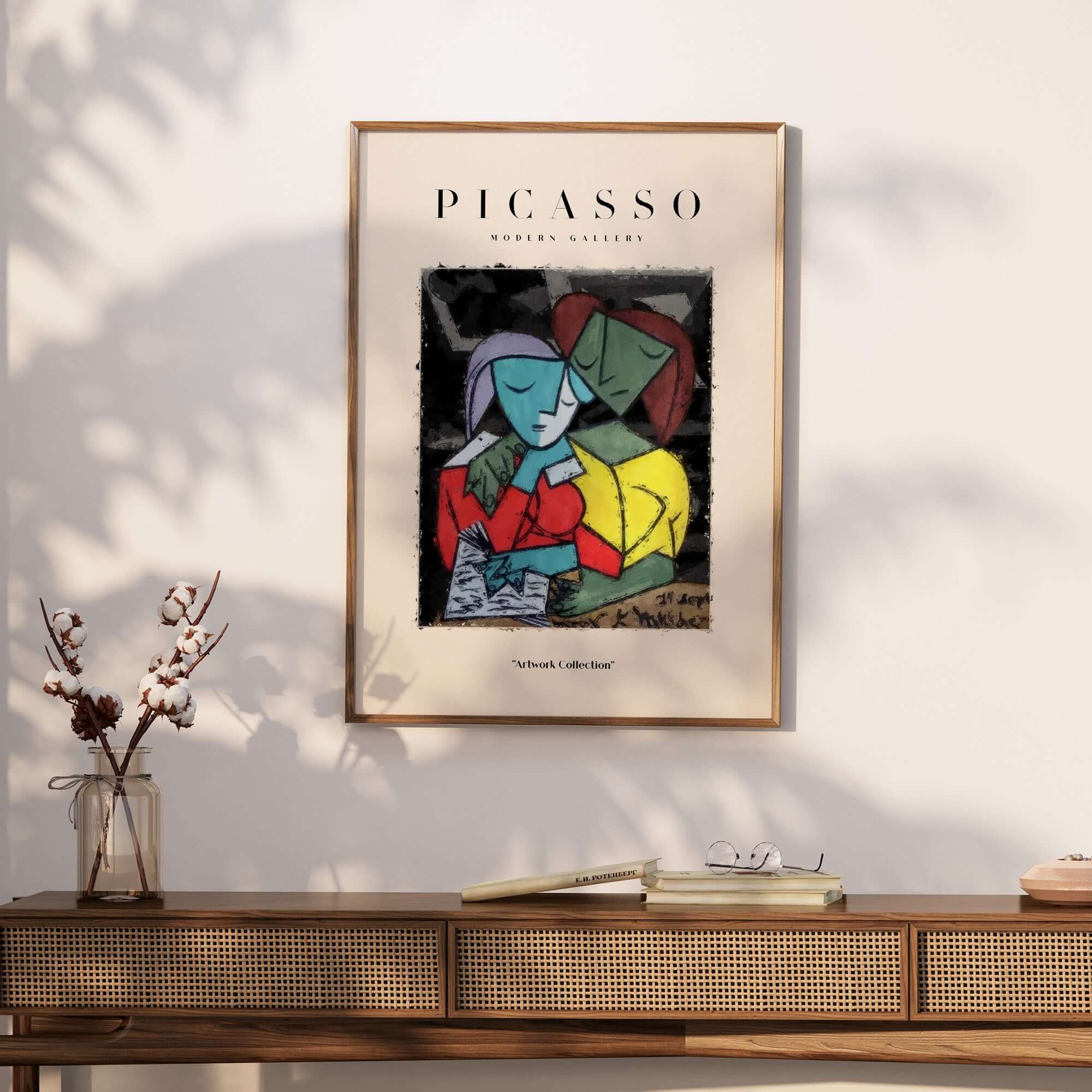Picasso Reading Couple Abstract Figures Art Print Cubist Poster Artwork Collection framed on a wall above a wooden table.