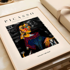 Picasso Seated Woman Cubist Portrait Art Print Modern Gallery Artwork Poster on a table in a stylish frame.
