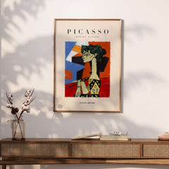 Picasso Seated Woman Profile Cubist Art Print Patterned Dress Poster Artwork Collection displayed on a wall.
