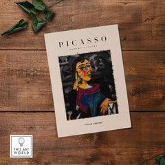 Picasso Seated Woman Cubist Portrait Art Print Modern Gallery Artwork Poster on wooden surface with decorative leaves