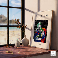 Picasso Seated Woman Reading Abstract Figure Art Print Modern Gallery Artwork Poster displayed on a sunny window ledge.