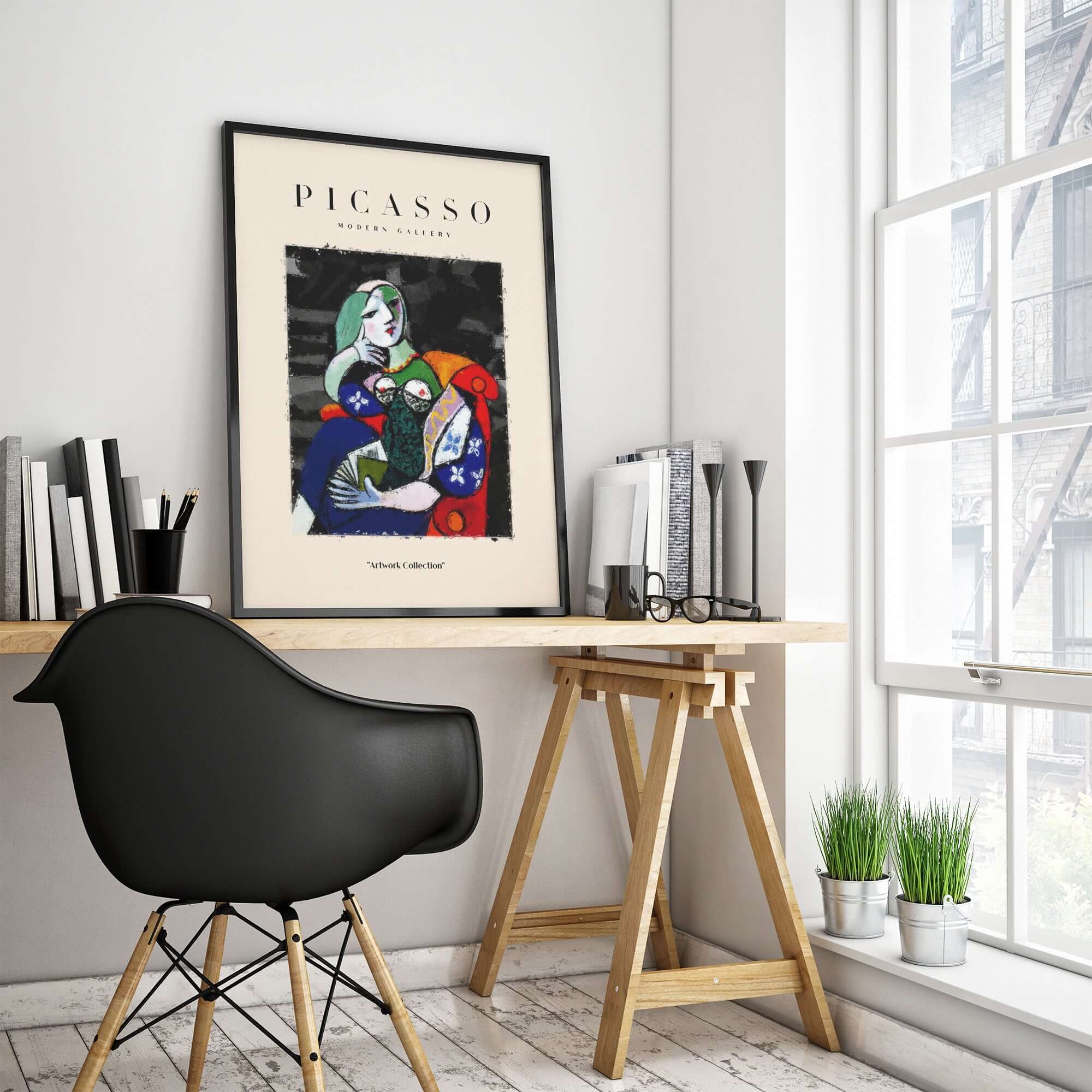 Picasso Seated Woman Reading Abstract Figure Art Print Modern Gallery Artwork Poster displayed on a desk against a bright room backdrop.