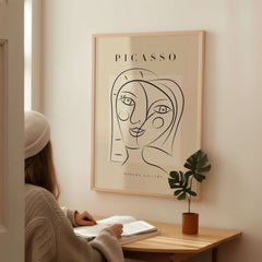 Picasso Smiling Double Face Abstract Portrait Line Art Modern Gallery Poster Print on wall with woman reading