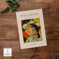Picasso Smiling Woman Abstract Portrait Poster Cubist Style Artwork Print Modern Gallery displayed on wooden background.