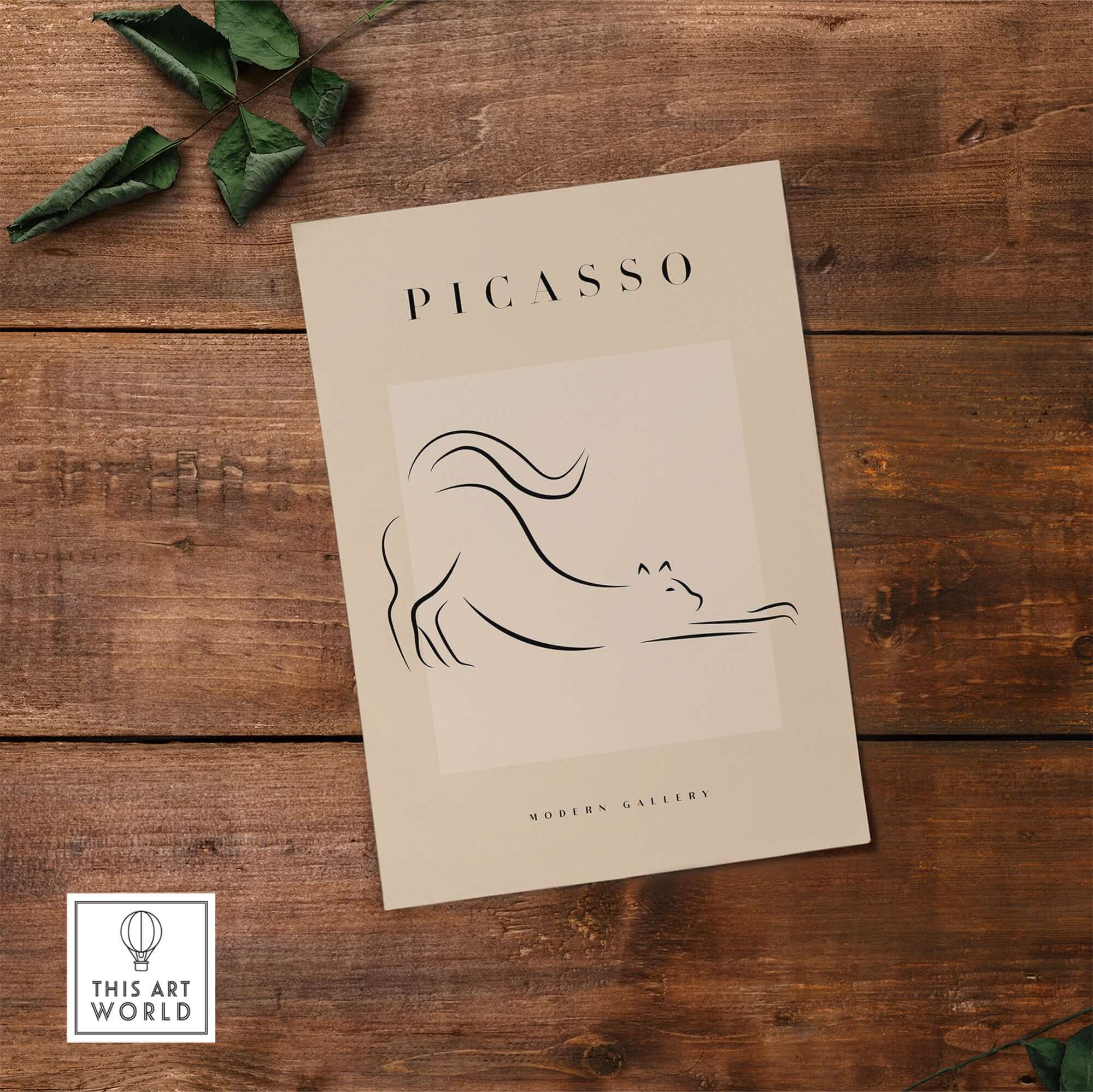 Picasso Stretching Cat Line Art Minimalist Animal Poster Modern Gallery Print Wall Art on wooden table with leaves
